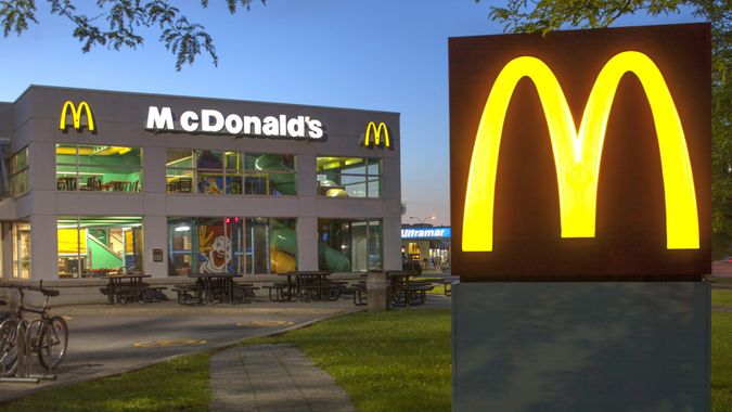 Longueuil,Quebec, Сanada - August 19, 2014: McDonald's restaurant at dusk with play place inside.