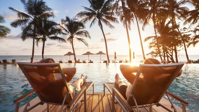luxury travel, romantic beach getaway holidays for honeymoon couple, tropical vacation in luxurious hotel.