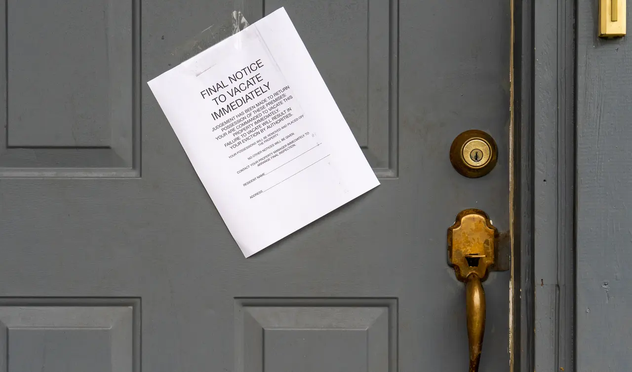 Eviction Final Notice to Vacate Immediately on House Door.