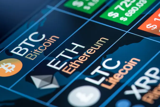 New york, USA - May 17, 2018: Different cryptocurrencies exchange to dollar rate on monitor display.