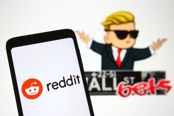 Mandatory Credit: Photo by Pavlo Gonchar/SOPA Images/Shutterstock (11751613x)In this photo illustration a Reddit logo is seen on a mobile phone screen in front of WallStreetBets (WSB) logo of a subreddit where participants discuss stock and options trading.