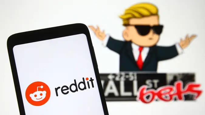 Mandatory Credit: Photo by Pavlo Gonchar/SOPA Images/Shutterstock (11751613x)In this photo illustration a Reddit logo is seen on a mobile phone screen in front of WallStreetBets (WSB) logo of a subreddit where participants discuss stock and options trading.