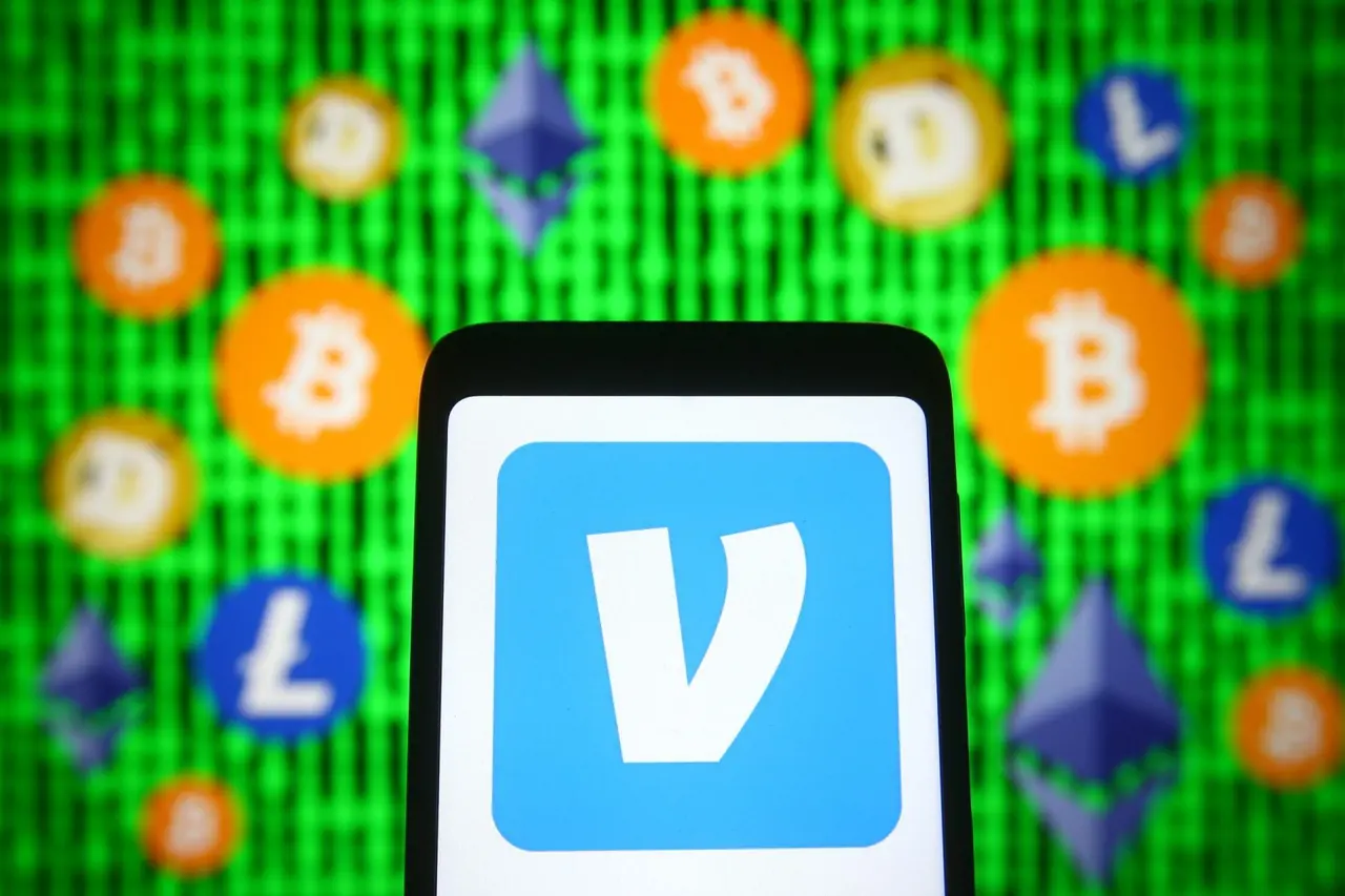 Mandatory Credit: Photo by Pavlo Gonchar/SOPA Images/Shutterstock (11884212q)In this photo illustration, Venmo logo of a mobile payment service is seen displayed on a smartphone screen in front of cryptocurrency signs.