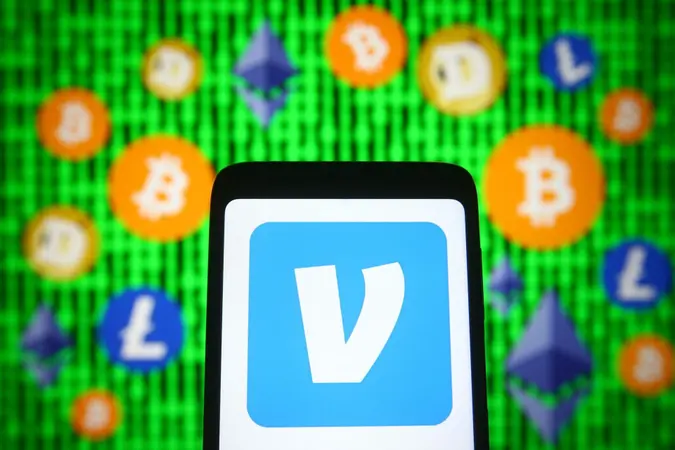 Mandatory Credit: Photo by Pavlo Gonchar/SOPA Images/Shutterstock (11884212q)In this photo illustration, Venmo logo of a mobile payment service is seen displayed on a smartphone screen in front of cryptocurrency signs.