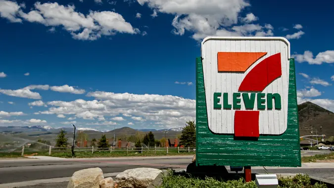 Park City, UT, May 12, 2017: 7-Eleven sign against a picturesque landscape is brightly lit by the sun.