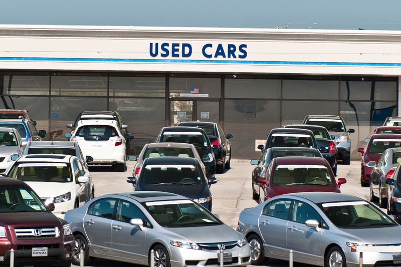 Alcoa, Tennessee, USA - April 10, 2011: The used car lot of a Honda dealer is dominated by late model used Hondas with a banner proclaiming them to be certified, that is to have a full Honda warranty.