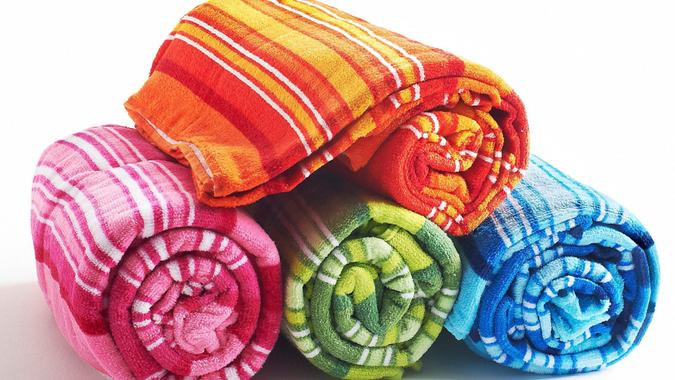 Rolled colorful beach bath (beach) towel.