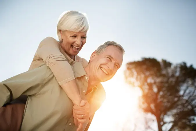 Cropped shot of a senior man giving his wife a piggyback outdoorshttp://195.