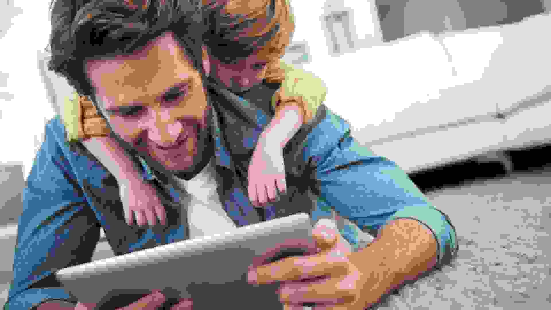 Cropped shot of a young father and son using a tablet together at homehttp://195.
