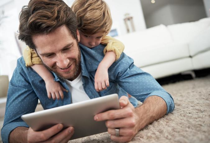 Cropped shot of a young father and son using a tablet together at homehttp://195.