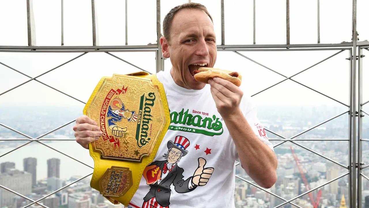 Mandatory Credit: Photo by Evan Agostini/Invision/AP/Shutterstock (10327453l)Eleven-time and defending men's champion Joey Chestnut poses on the 86th floor observation deck during the Nathan's Famous international Fourth of July hot dog eating contest weigh-in at the Empire State Building, in New York2019 Nathan's Hot Dog Eating Contest Weigh-In, New York, USA - 03 Jul 2019.
