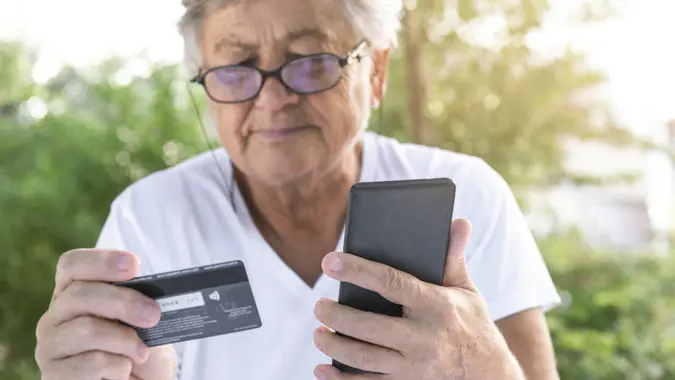 Senior Woman With Credit Card stock photo