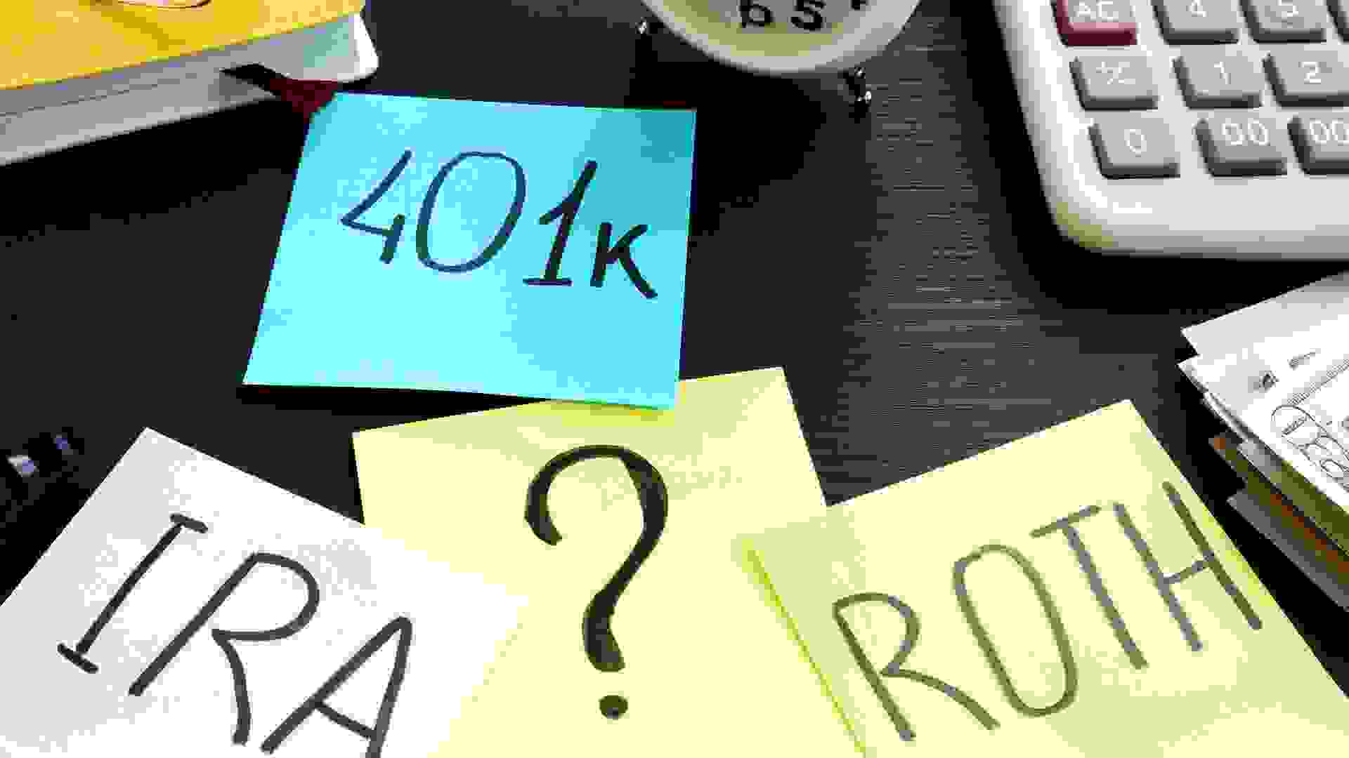401k ira roth on pieces of paper. Retirement planning. stock photo
