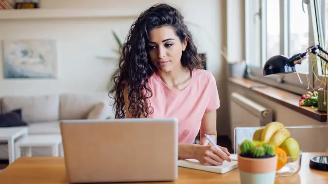 A woman searches for a job online.