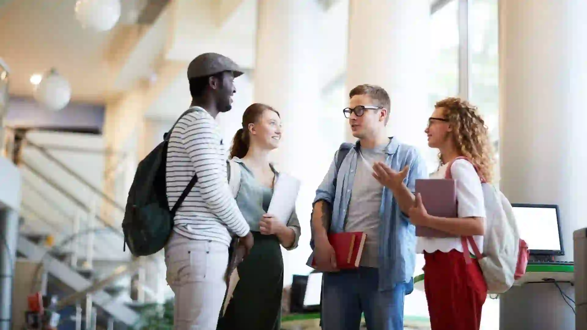 Group of casual groupmates discussing their thoughts about working over home task for next lesson.