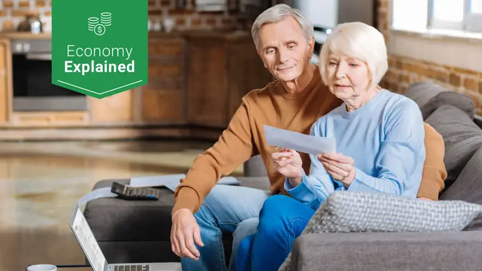 elderly couple receiving social security check