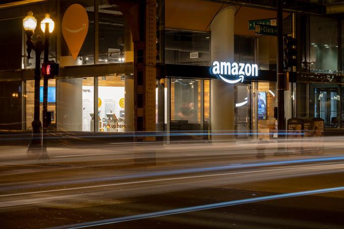 Chicago, USA Oct 8, 2018: Cars passing the Amazon E-commerce pick up store early in the night in the Loop.