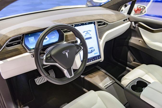 Brussels, Belgium - January 13, 2017: Luxurious interior on a Tesla Model X P90D full electric luxury crossover SUV car with a large touch screen and dashboard screen.