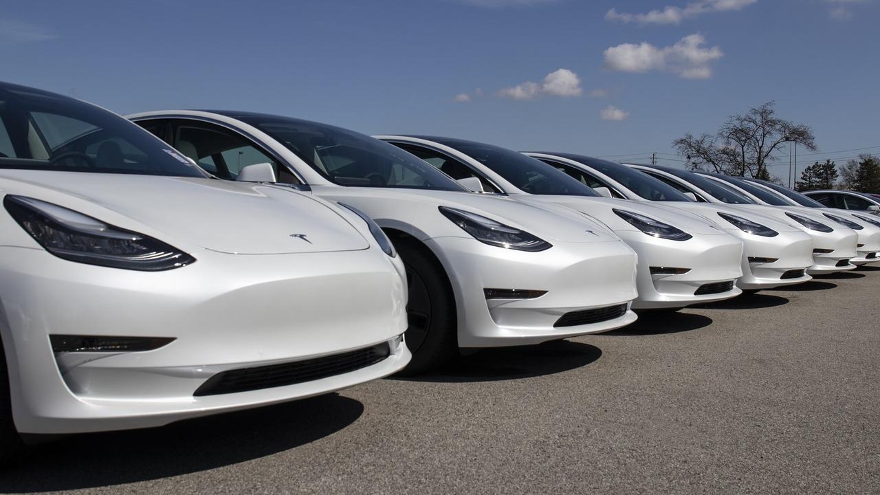 Tesla electric vehicles awaiting preparation for sale. Tesla EV Model 3, S and X are a key to a cleaner and greener environment. stock photo