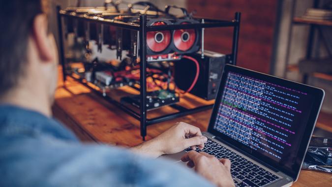 Man mining for bitcoin stock photo