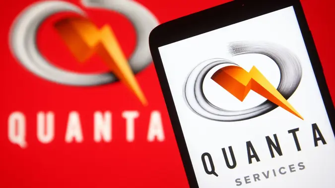 Mandatory Credit: Photo by Pavlo Gonchar/SOPA Images/Shutterstock (12205310a)In this photo illustration a Quanta Services logo is seen on a smartphone and a pc screen.
