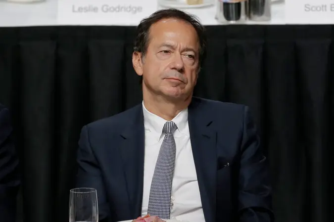 Mandatory Credit: Photo by Seth Wenig/AP/Shutterstock (10473155i)John Paulson listens while President Donald Trump speaks during a meeting of the Economic Club of New York in New YorkTrump, New York, USA - 12 Nov 2019.