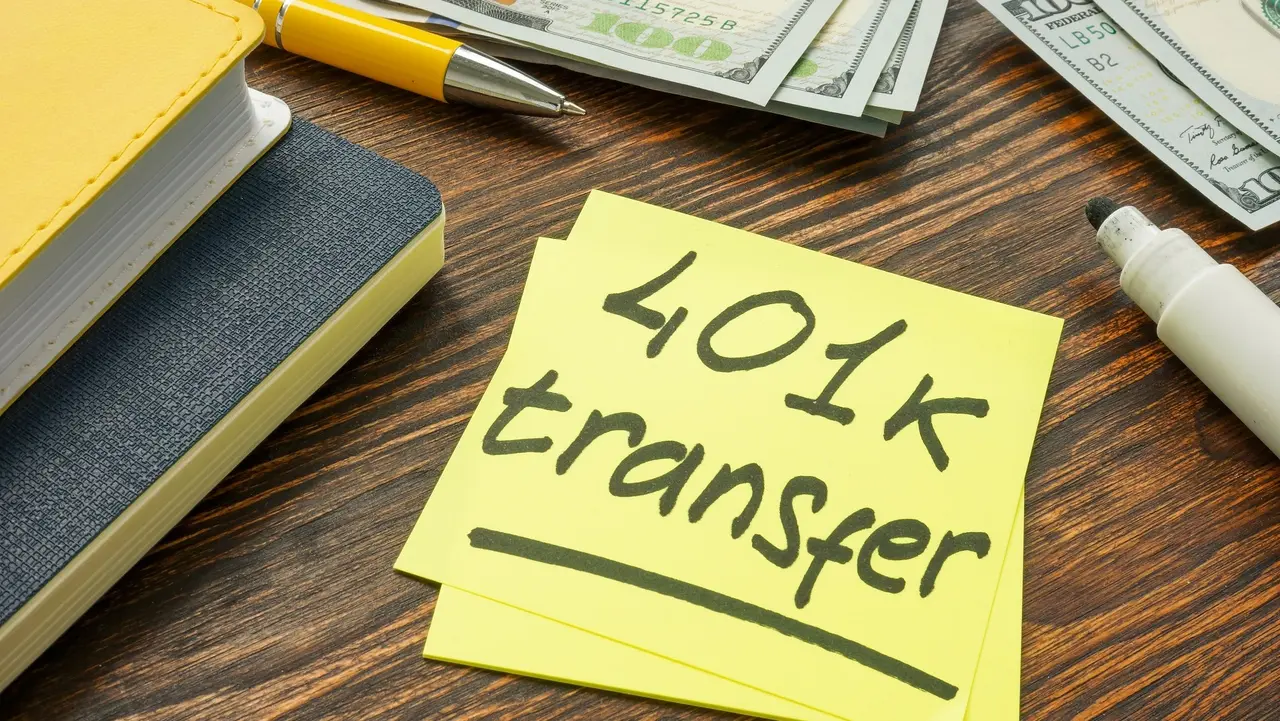 401k transfer to another retirement plan sign and money. stock photo
