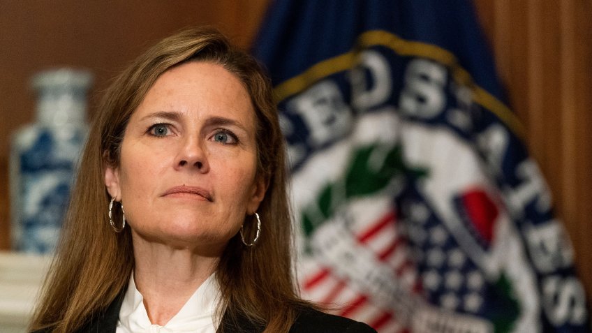 Mandatory Credit: Photo by Shutterstock (10909760f)United States Supreme Court nominee Judge Amy Coney Barrett, right, listens as United States Senator Jerry Moran (Republican of Kansas), speaks during their meeting on Capitol Hill, in Washington.