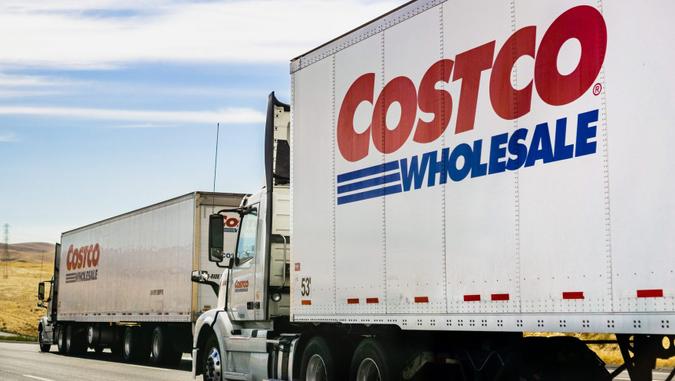 June 28, 2019 Stockton / CA / USA - Branded Costco Wholesale trucks driving on the freeway.