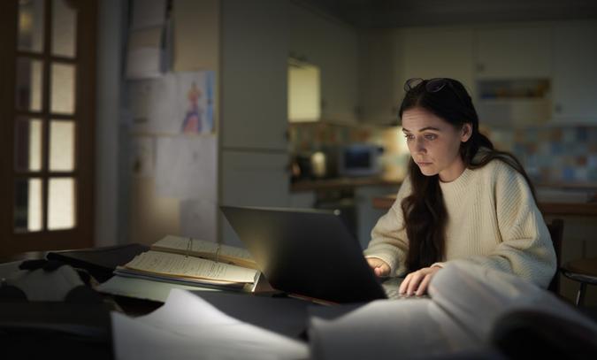 student burning the midnight oil after a long shift.