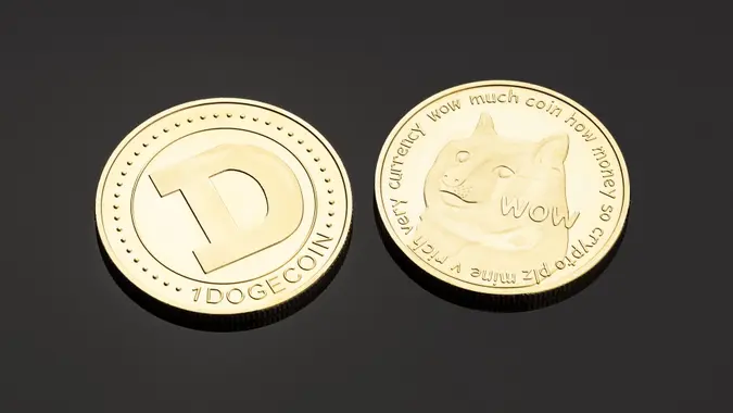 Galicia, Spain; June 11, 2021:Dogecoin coin isolated on black background.