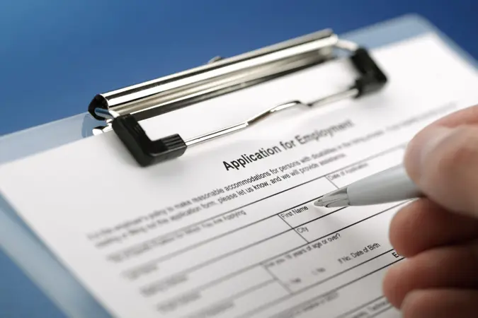 Completing an employment application form.