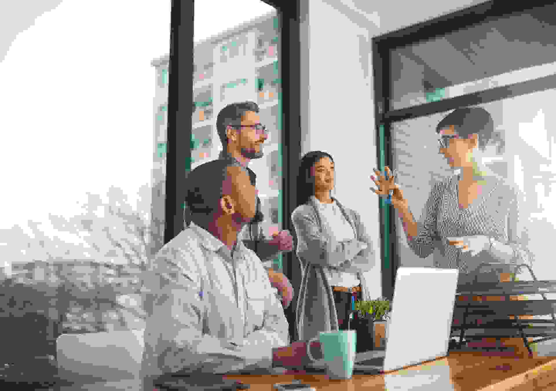 Cropped shot of a group of colleagues having a discussion in a modern office.