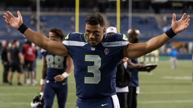Mandatory Credit: Photo by Stephen Brashear/AP/Shutterstock (12387768fc)Seattle Seahawks quarterback Russell Wilson gestures as he walks off the field after an NFL preseason football game against the Los Angeles Chargers, in Seattle.