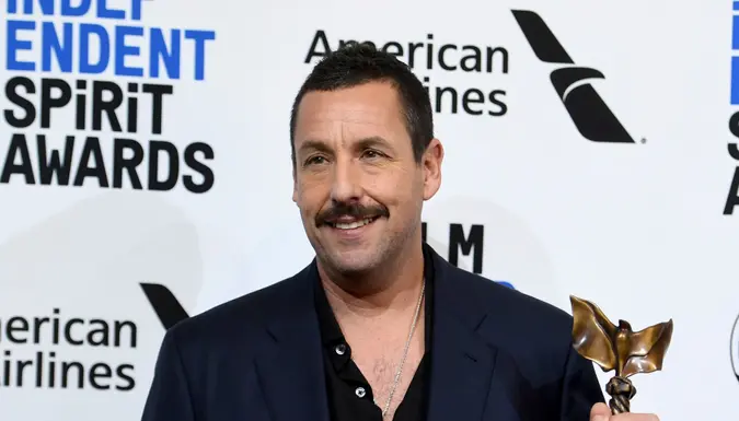 Mandatory Credit: Photo by Richard Shotwell/Invision/AP/Shutterstock (10551778q)Adam Sandler poses in the press room with the award for best male lead for "Uncut Gems at the 35th Film Independent Spirit Awards, in Santa Monica, Calif2020 Film Independent Spirit Awards - Press Room, Santa Monica, USA - 08 Feb 2020.
