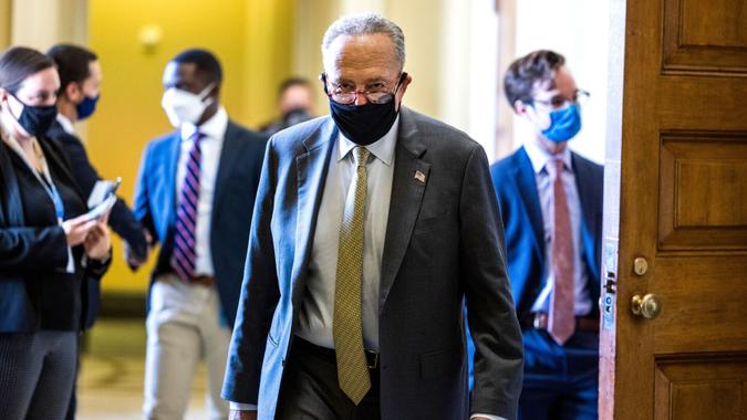 Mandatory Credit: Photo by JIM LO SCALZO/EPA-EFE/Shutterstock (12517158b)Senate Majority Leader Chuck Schumer walks to the Senate floor following Senate passage of a stopgap funding bill to prevent a government shutdown in the US Capitol Washington, DC, USA, 30 September 2021.