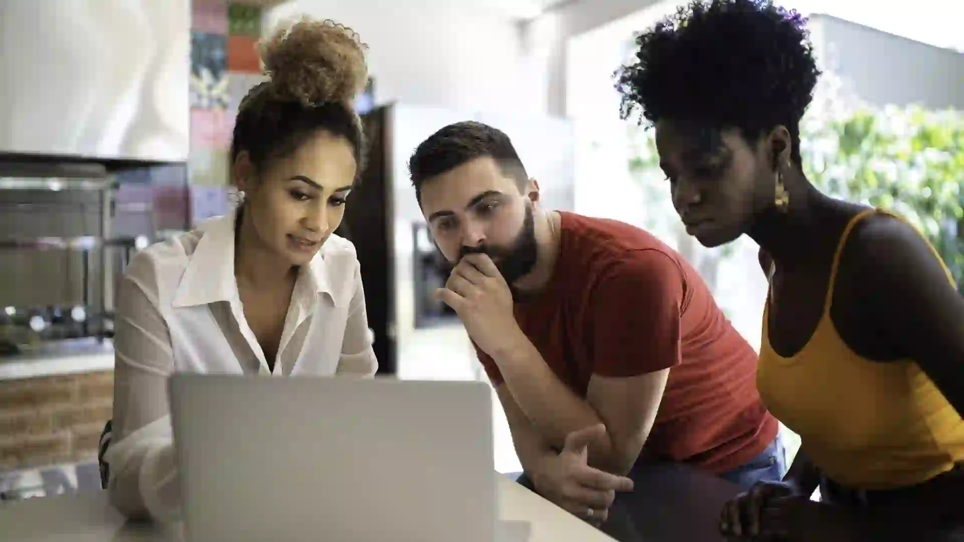 Real estate agent/financial advisor talking to a young couple stock photo