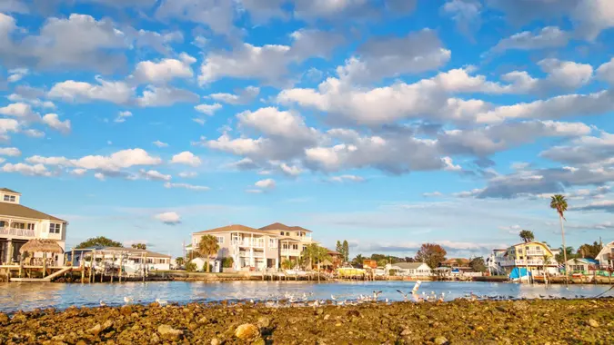 Stock photograph of waterfront homes in Hudson New Port Richey Florida USA after sunset.