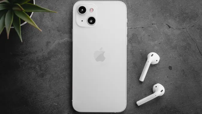 Antalya, Turkey - September 14, 2021: Back view of new iPhone 13 white smartphone.