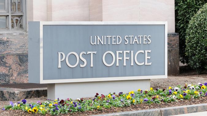 "Close up of United States Post Office sign, horizontal.