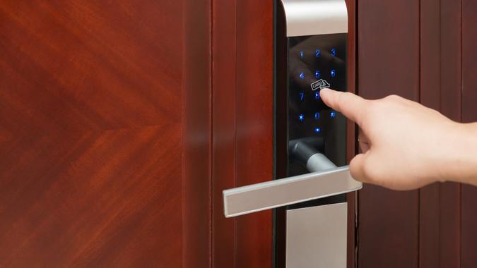 inputing passwords on an electronic door lock.