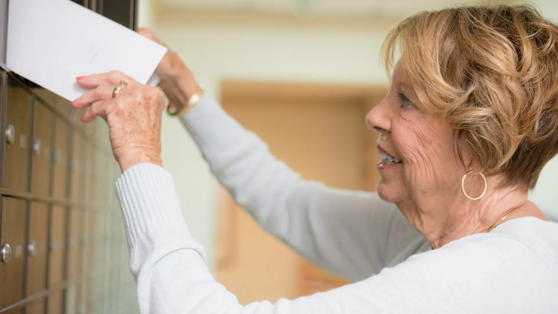 Senior woman getting the mail stock photo