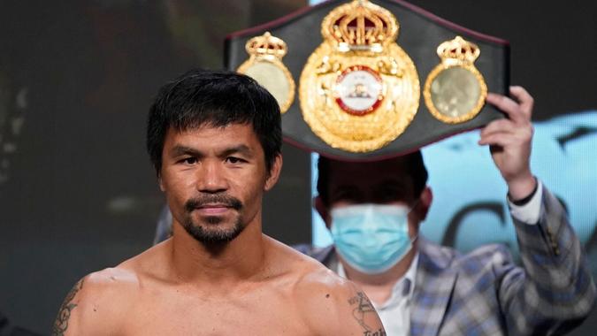 Mandatory Credit: Photo by John Locher/AP/Shutterstock (12451479a)Manny Pacquiao, of the Philippines, poses for photographers during a weigh-in in Las Vegas.