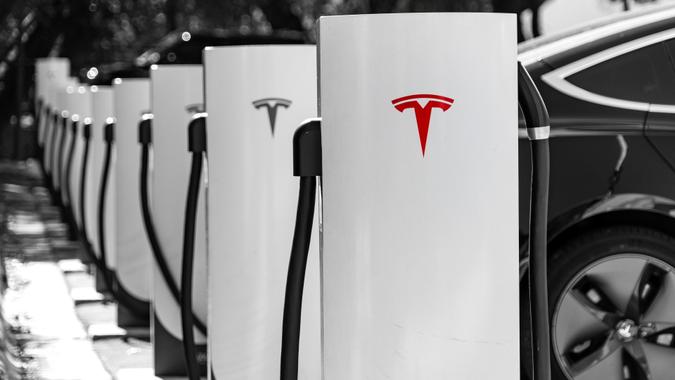 Tesla Charging on the Tesla Supercharging fast charging network stock photo