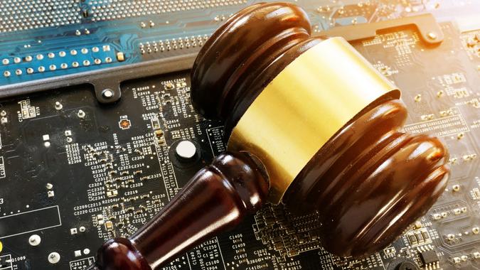 Gavel and electronic devices. Regulation of blockchain. stock photo
