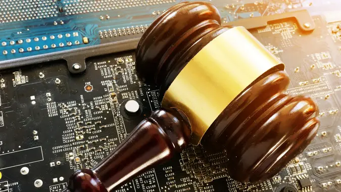 Gavel and electronic devices. Regulation of blockchain. stock photo