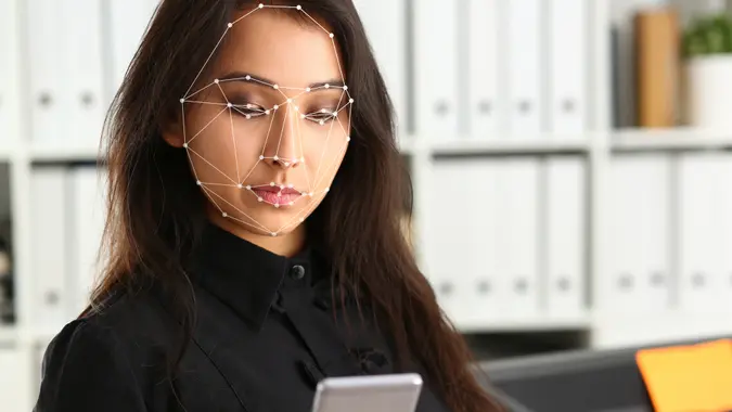 Businesswoman look at smartphone.