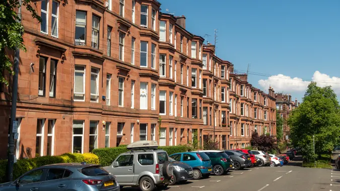 Glasgow, Scotland - A long street of traditional tenement flat buildings in Hyndland, in Glasgow's West End.