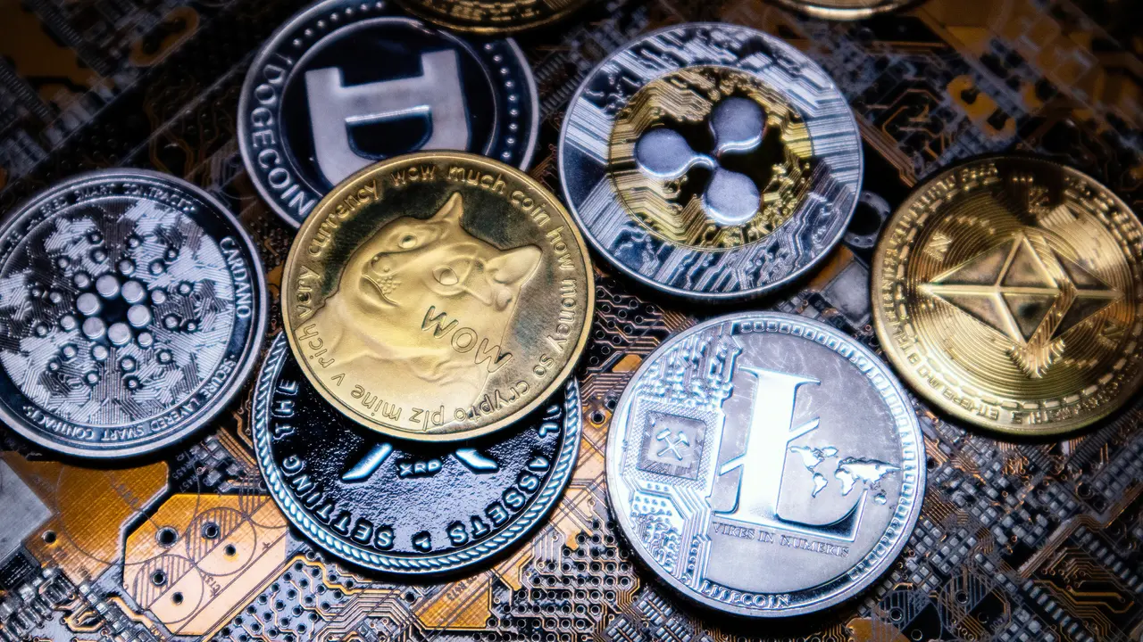 Antalya, Turkey - April 25,  2021: Close up shot of alt coins cryptocurrency over computer circuit.