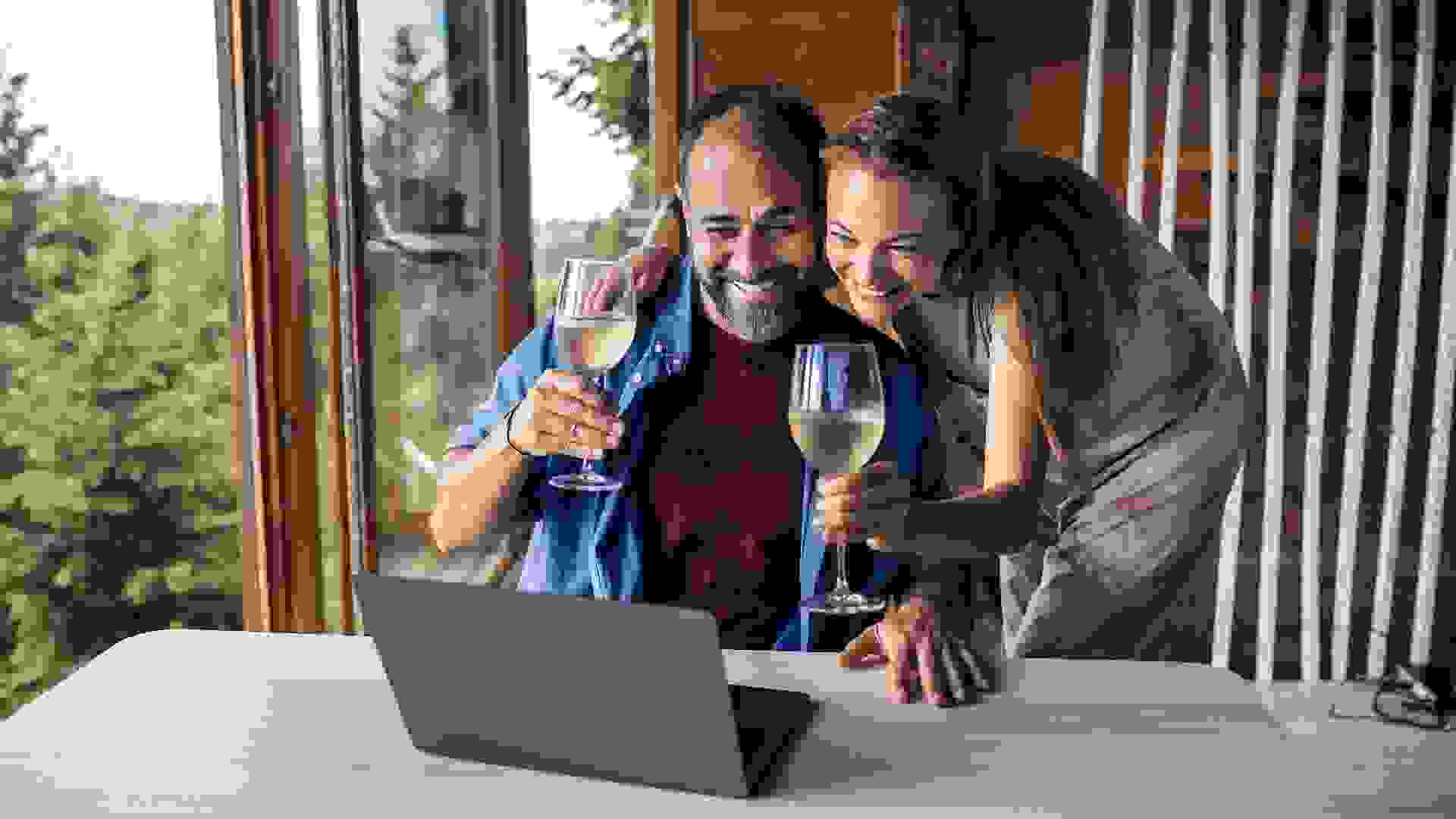 Couple having a video call on their laptop stock photo